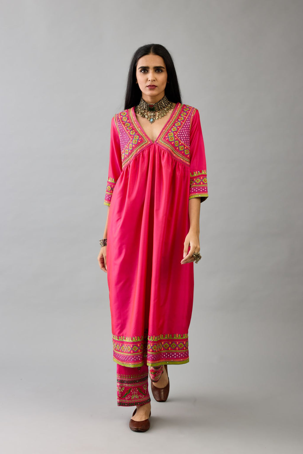 Fuchsia silk embroidered kurta dress with V neck, yoke and fine gathers at empire line.