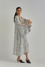 Off White long A-line kaftan with all-over earthy coloured hand block print and appliqué flowers, thread work and silk tassels.