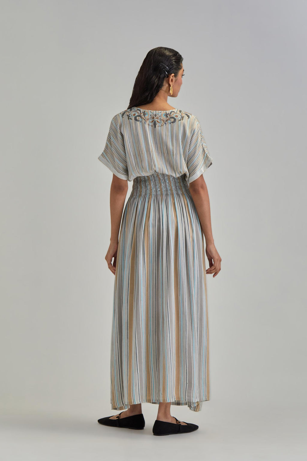 Off White long dress with all-over earthy coloured stripe hand block print and Aari thread work at neck.