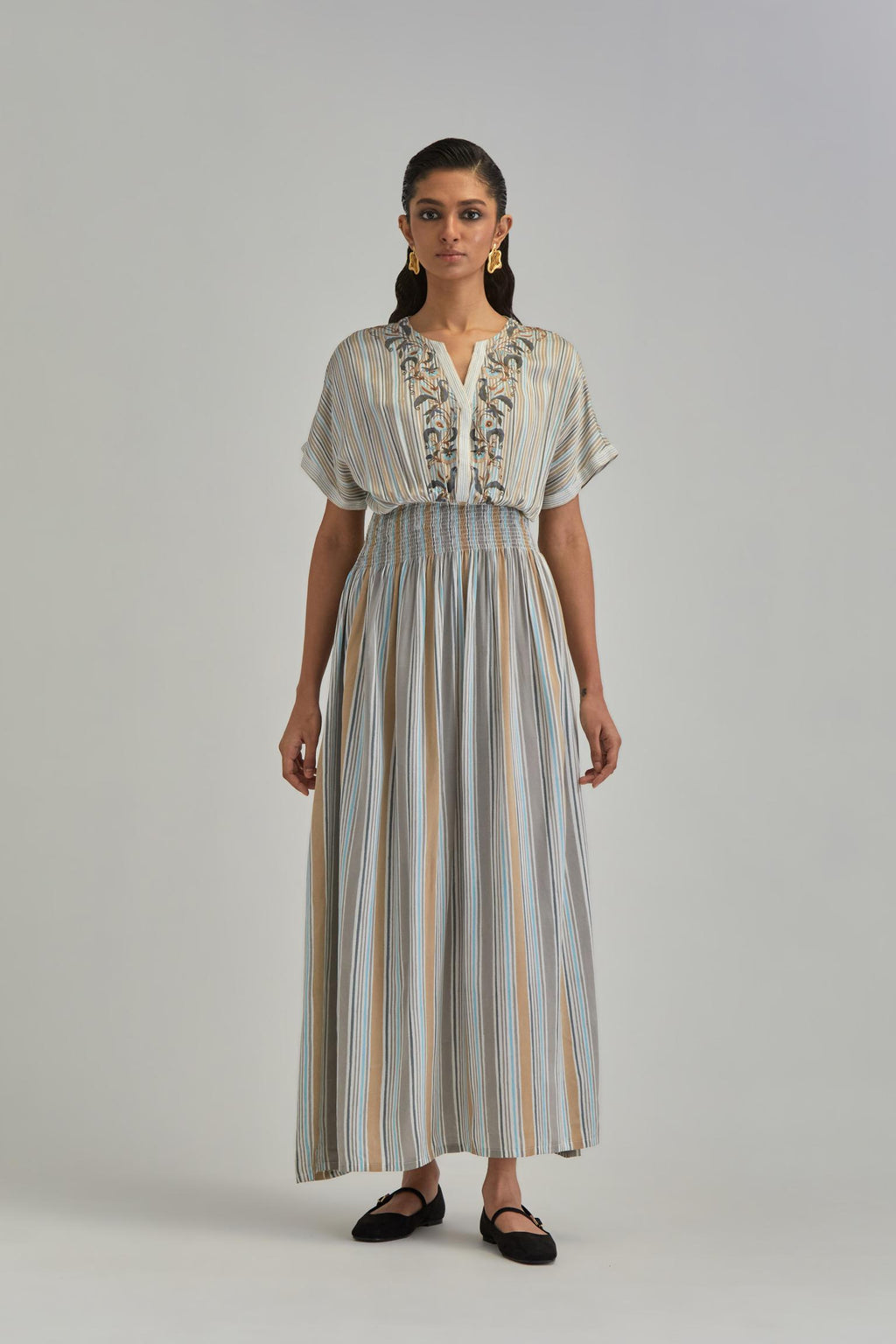 Off White long dress with all-over earthy coloured stripe hand block print and Aari thread work at neck.