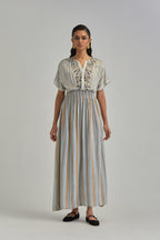Off White long dress with all-over earthy coloured stripe hand block print and Aari thread work at neck.