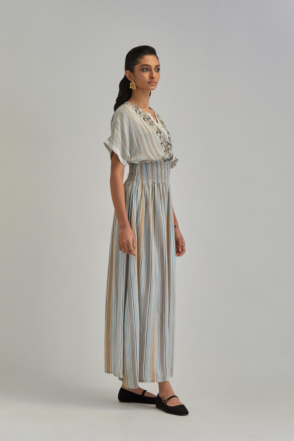 Off White long dress with all-over earthy coloured stripe hand block print and Aari thread work at neck.