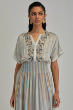 Off White long dress with all-over earthy coloured stripe hand block print and Aari thread work at neck.