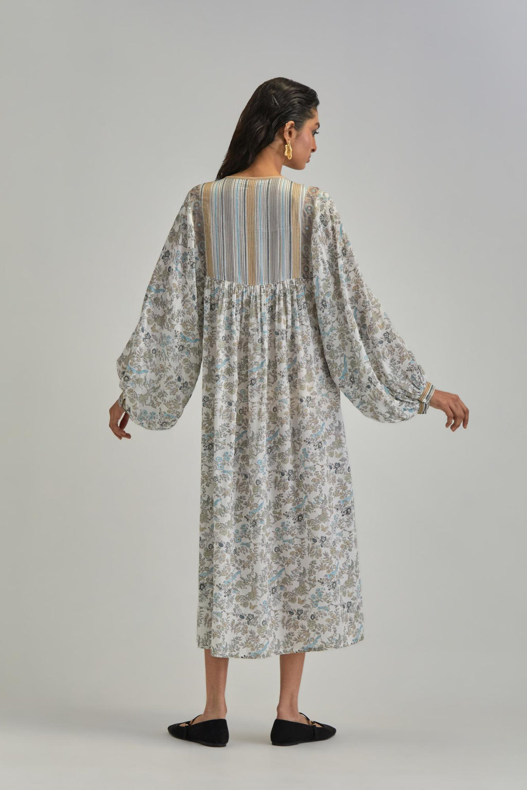 Off White dress with all-over earthy coloured hand block print and Aari thread work yoke.