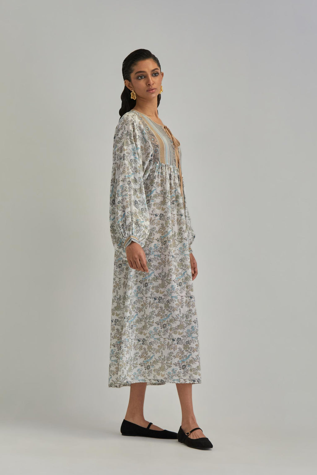 Off White dress with all-over earthy coloured hand block print and Aari thread work yoke.