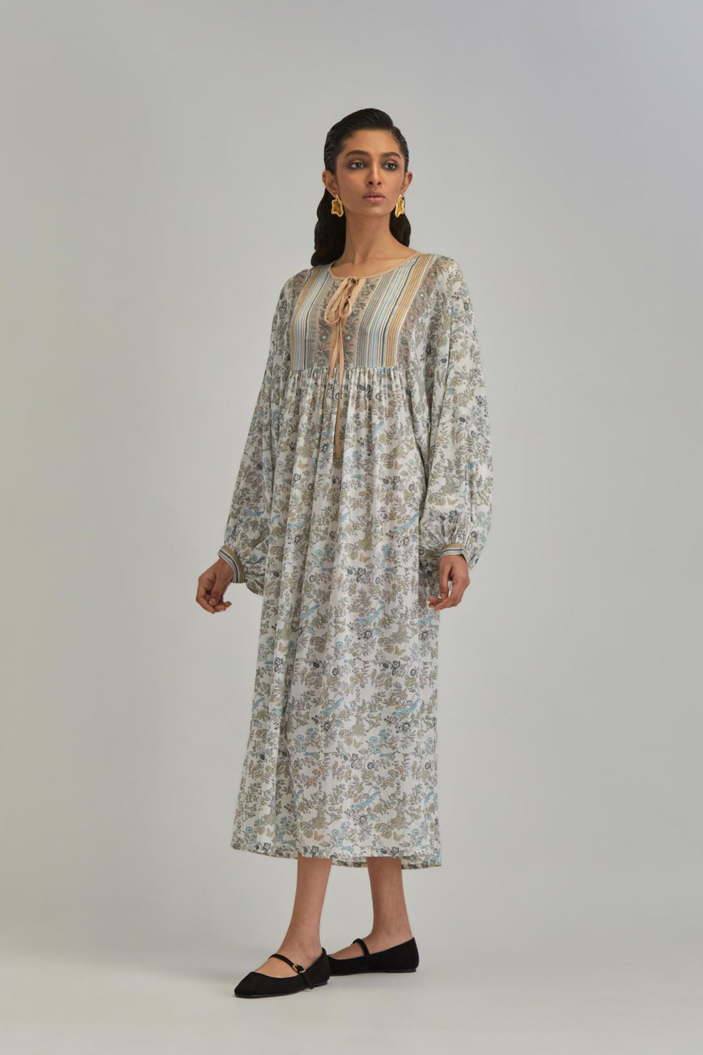 Off White dress with all-over earthy coloured hand block print and Aari thread work yoke.