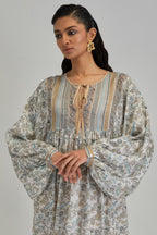 Off White dress with all-over earthy coloured hand block print and Aari thread work yoke.
