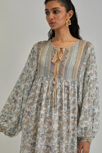 Off White dress with all-over earthy coloured hand block print and Aari thread work yoke.