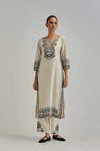 Off White slim fit straight kurta set, decorated with bold appliqué borders all along the side seam, hem and sleeve cuffs.