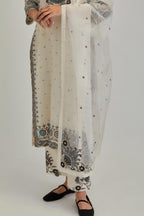 Off White silk organza dupatta with appliqué work and earthy coloured flower embroidery all-over the dupatta.