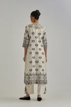 Off White straight kurta, fully embroidered with appliqué flowers, earthy-coloured Aari thread work and silk tassels.