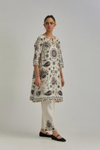 Off White short A-line silk Chanderi kurta set, fully embroidered with earthy coloured appliqué with Aari thread work and silk tassels.