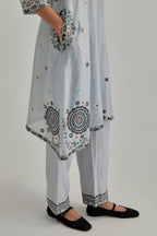 Blue silk Chanderi short V-neck kurta set, with straight hem and side pockets, decorated with fine appliqué and Aari thread embroidery.