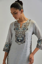 Blue slim fit straight kurta set, decorated with bold appliqué borders all along the side seam, hem and sleeve cuffs.