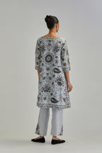 Blue short A-line silk Chanderi kurta set, fully embroidered with earthy coloured appliqué with Aari thread work and silk tassels.