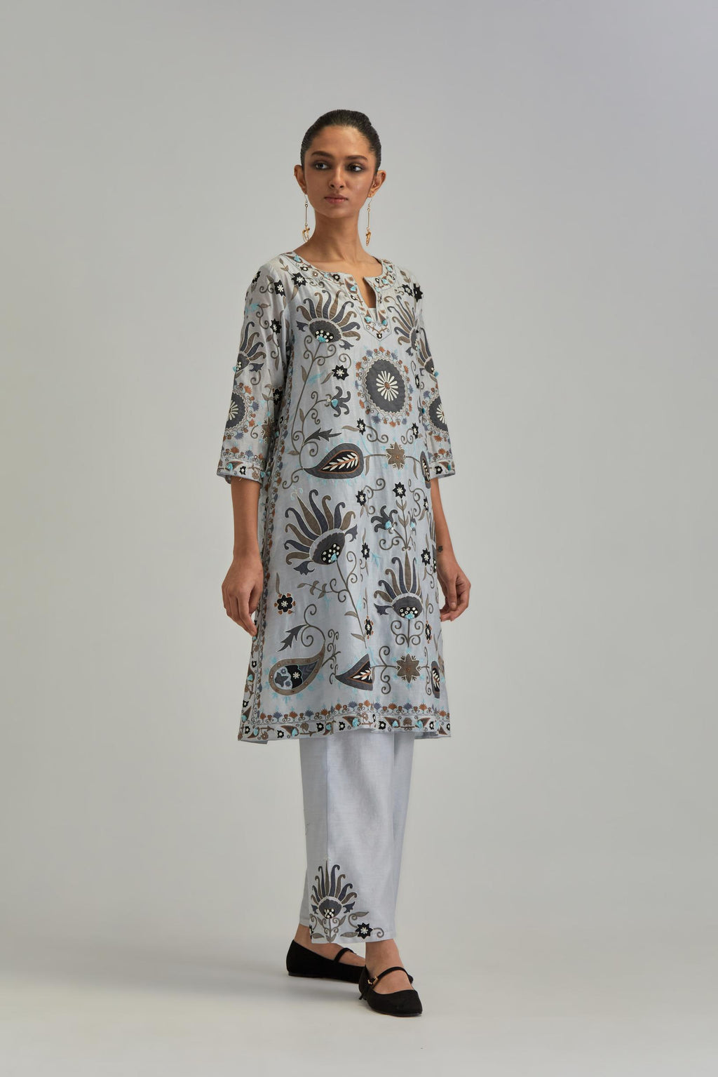 Blue short A-line silk Chanderi kurta set, fully embroidered with earthy coloured appliqué with Aari thread work and silk tassels.