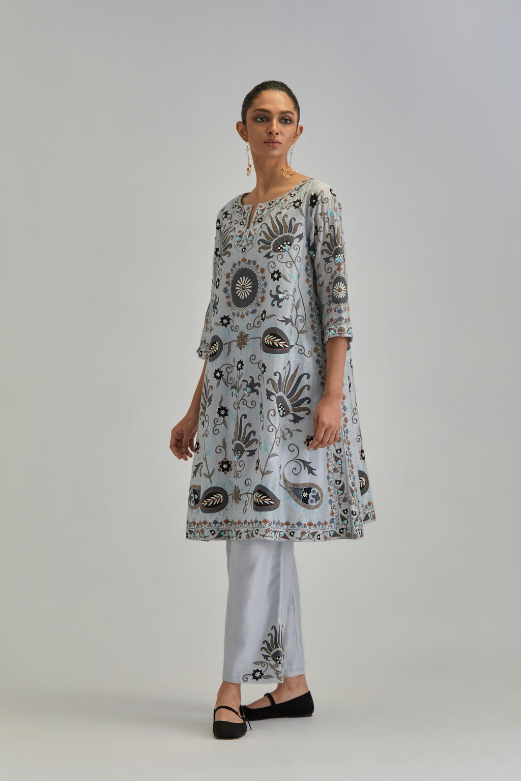 Blue short A-line silk Chanderi kurta set, fully embroidered with earthy coloured appliqué with Aari thread work and silk tassels.