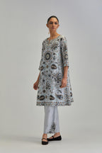 Blue short A-line silk Chanderi kurta set, fully embroidered with earthy coloured appliqué with Aari thread work and silk tassels.