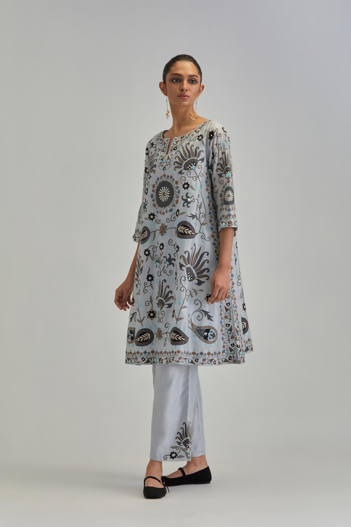 Blue short A-line silk Chanderi kurta set, fully embroidered with earthy coloured appliqué with Aari thread work and silk tassels.
