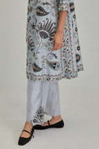 Blue short A-line silk Chanderi kurta set, fully embroidered with earthy coloured appliqué with Aari thread work and silk tassels.