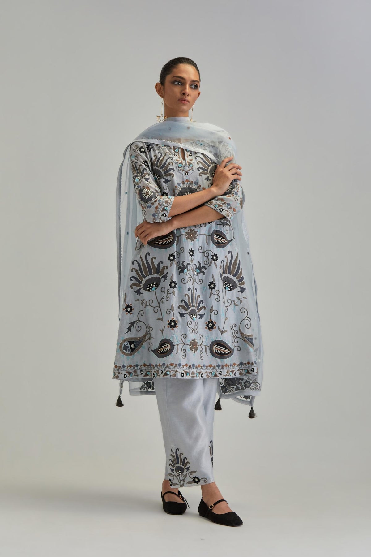 Blue short A-line silk Chanderi kurta set, fully embroidered with earthy coloured appliqué with Aari thread work and silk tassels.