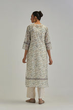 Silk Chanderi straight long kurta set with all-over earthy coloured hand block print and embroidery at kurta hem and sleeves.