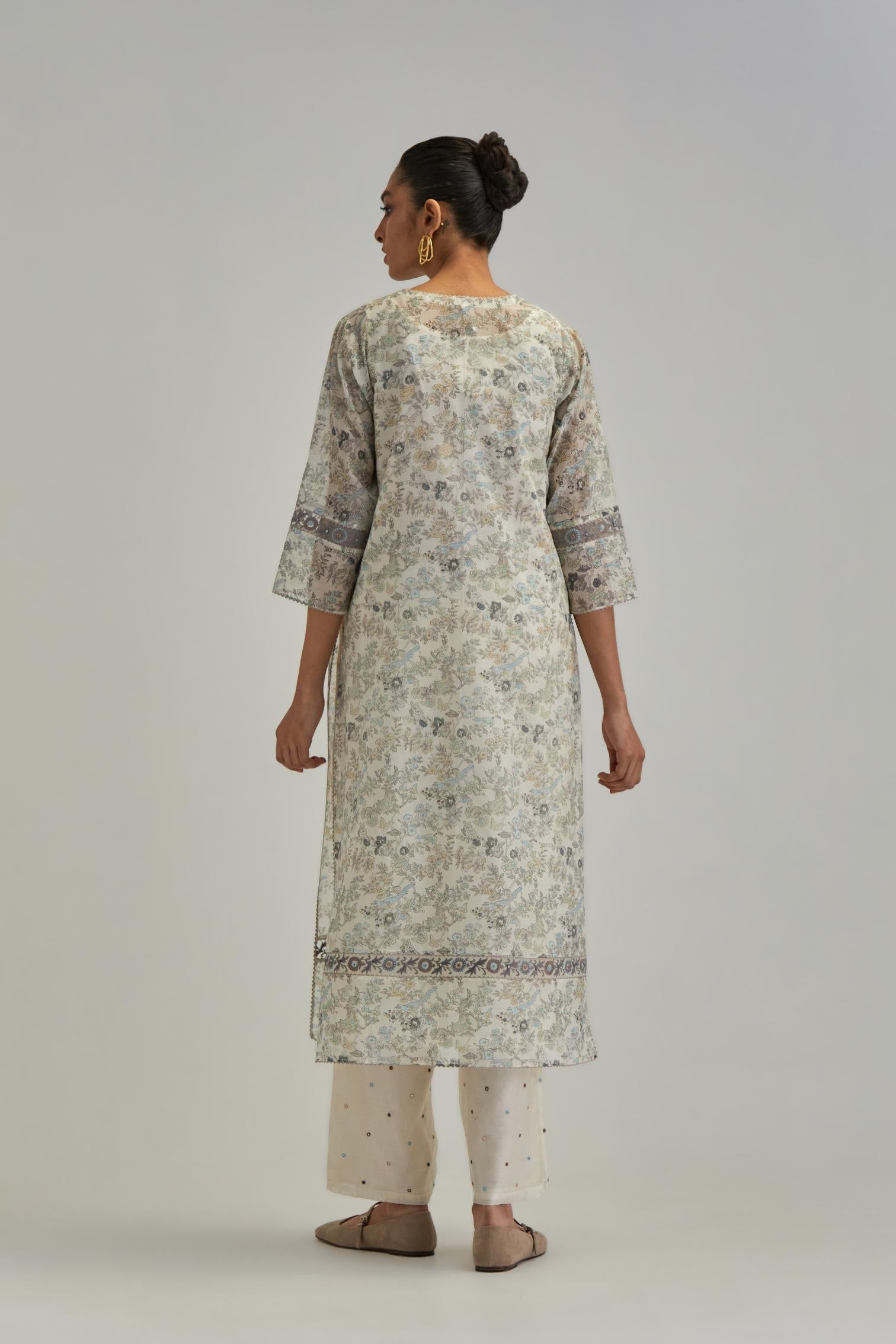 Silk Chanderi straight long kurta set with all-over earthy coloured hand block print and embroidery at kurta hem and sleeves.