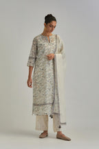 Silk Chanderi straight long kurta set with all-over earthy coloured hand block print and embroidery at kurta hem and sleeves.