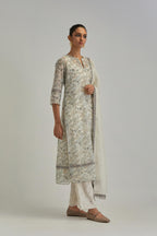 Silk Chanderi straight long kurta set with all-over earthy coloured hand block print and embroidery at kurta hem and sleeves.