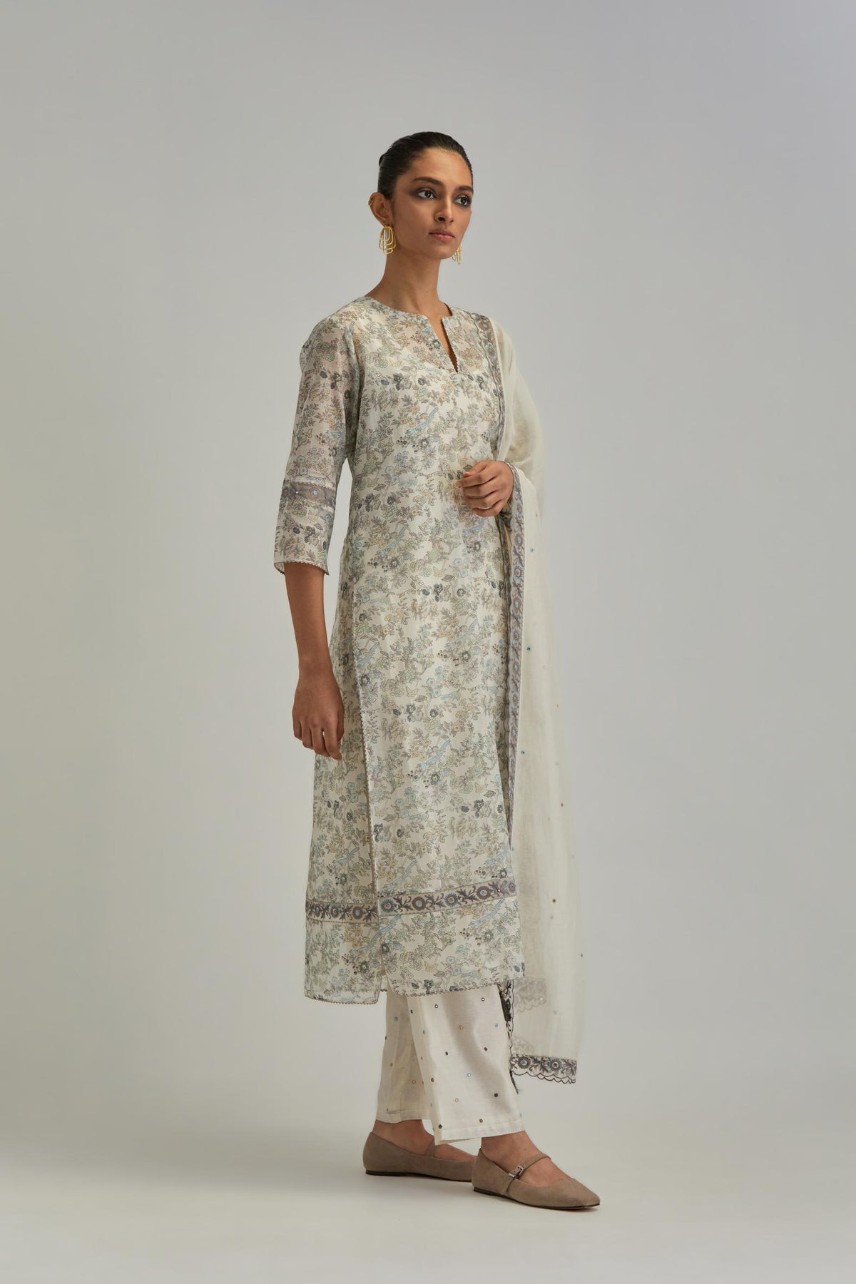 Silk Chanderi straight long kurta set with all-over earthy coloured hand block print and embroidery at kurta hem and sleeves.