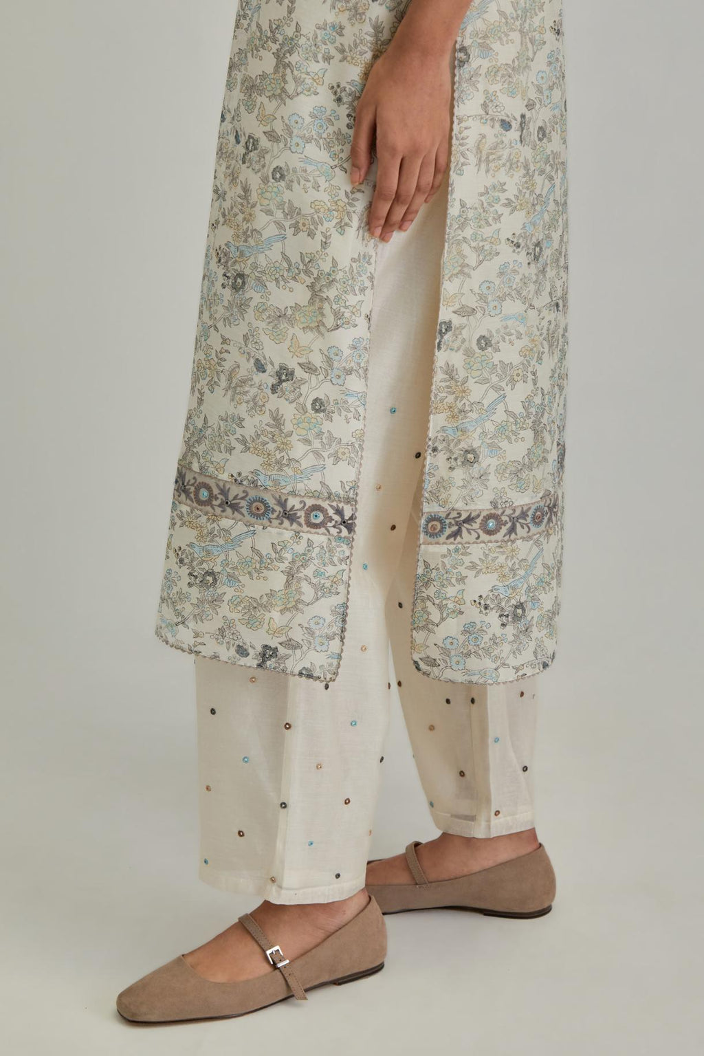 Silk Chanderi straight long kurta set with all-over earthy coloured hand block print and embroidery at kurta hem and sleeves.
