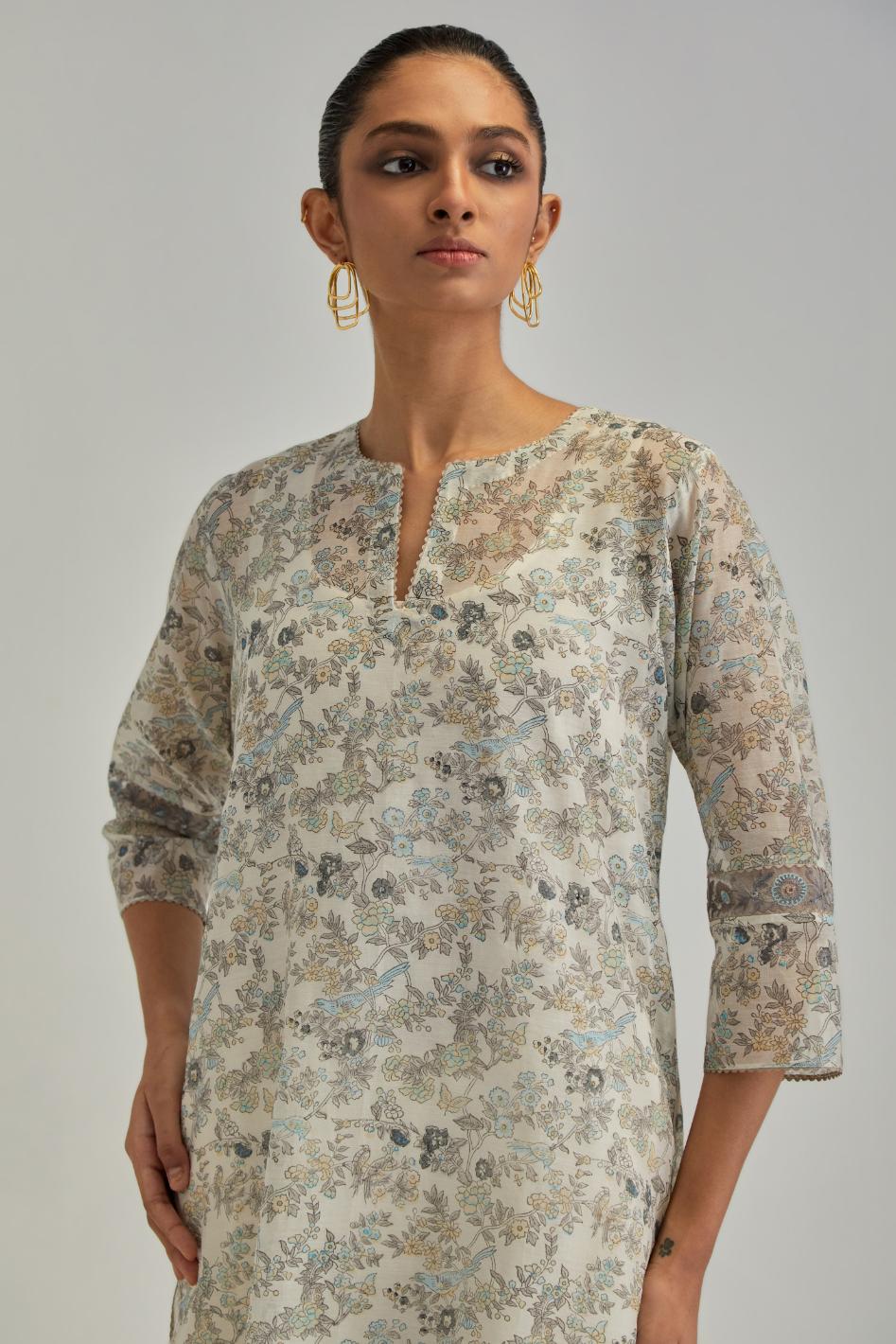 Silk Chanderi straight long kurta set with all-over earthy coloured hand block print and embroidery at kurta hem and sleeves.