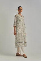 Silk Chanderi straight long kurta set with all-over earthy coloured hand block print and embroidery at kurta hem and sleeves.