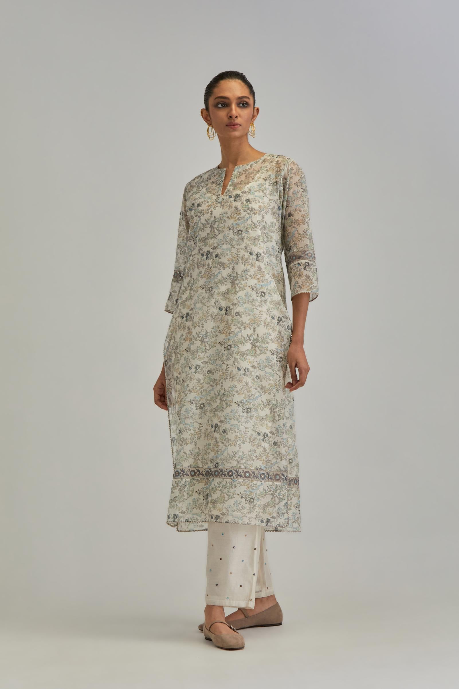 Silk Chanderi straight long kurta set with all-over earthy coloured hand block print and embroidery at kurta hem and sleeves.