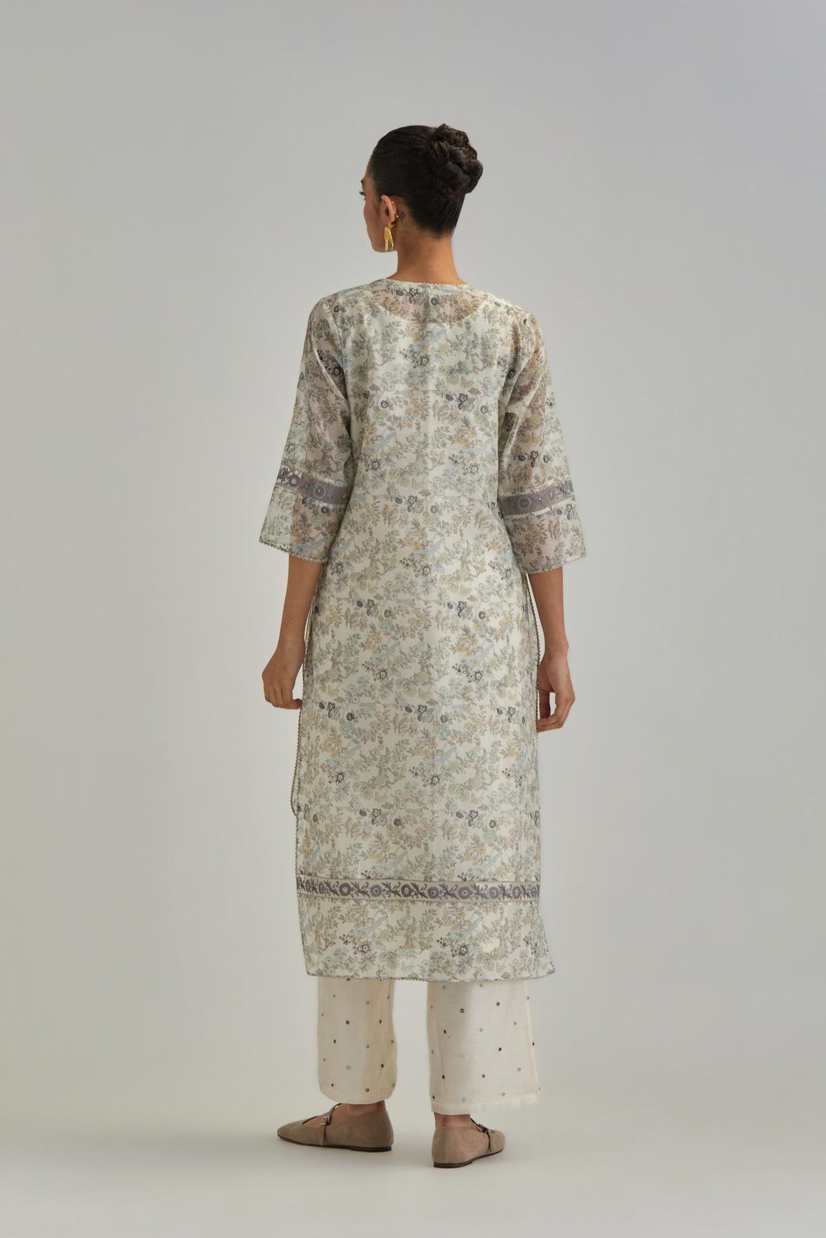Silk Chanderi kurta set with all-over earthy coloured hand block print and embroidery at neck, kurta hem and sleeves.