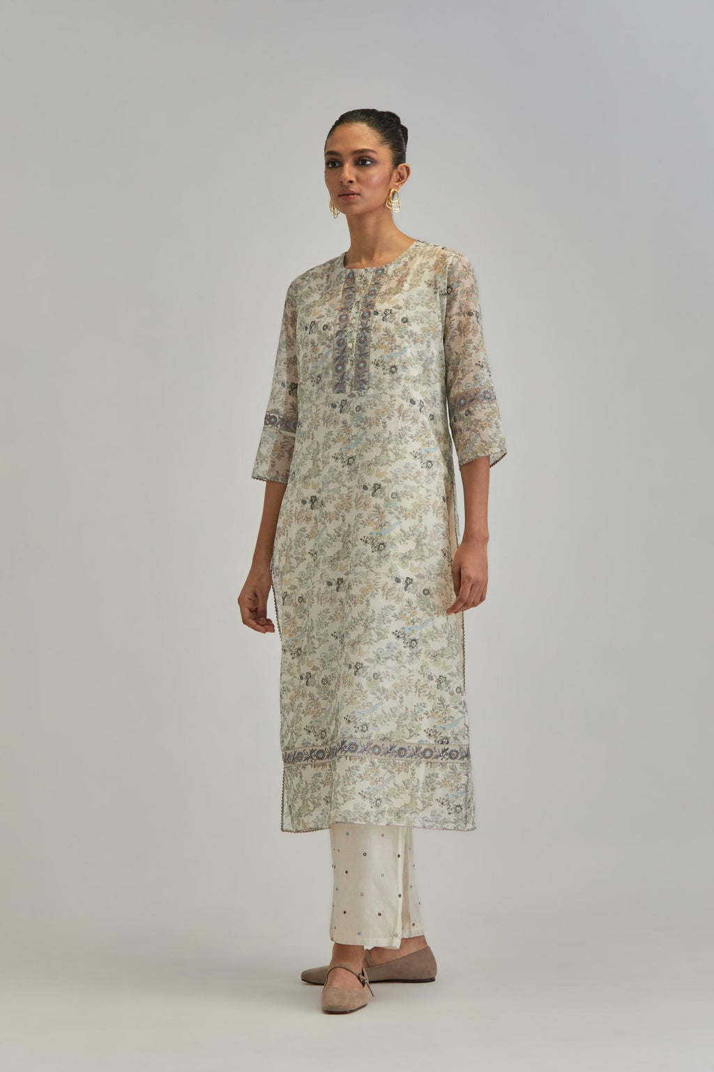 Silk Chanderi kurta set with all-over earthy coloured hand block print and embroidery at neck, kurta hem and sleeves.