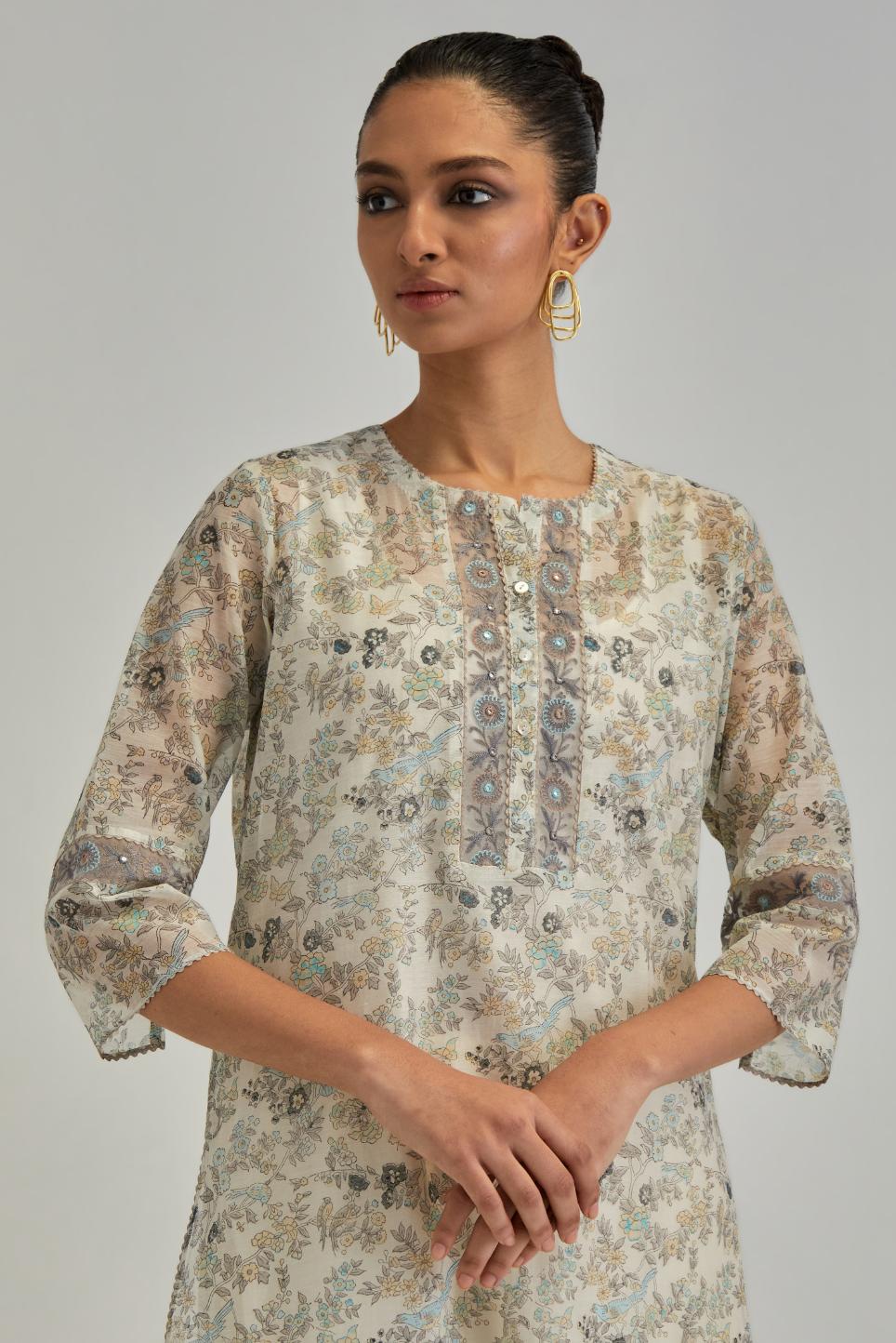 Silk Chanderi kurta set with all-over earthy coloured hand block print and embroidery at neck, kurta hem and sleeves.