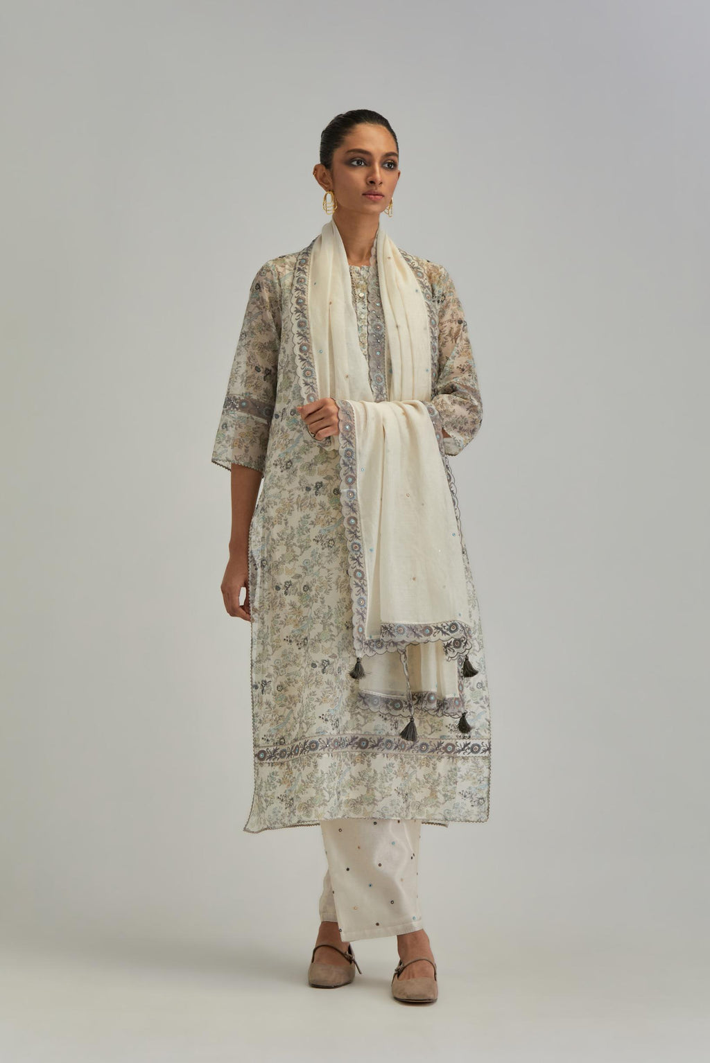 Silk Chanderi kurta set with all-over earthy coloured hand block print and embroidery at neck, kurta hem and sleeves.