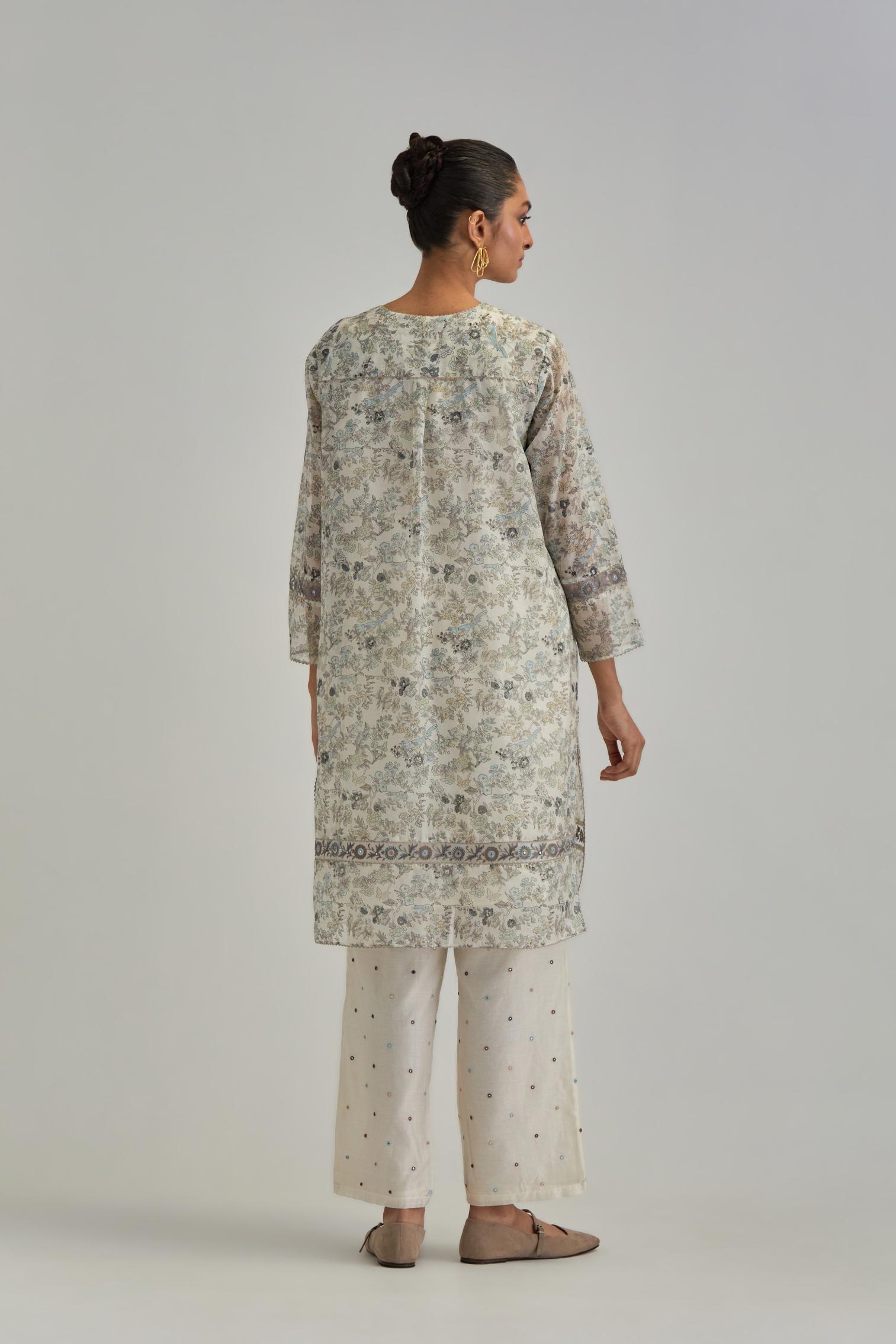Silk Chanderi short kurta set with all-over earthy coloured hand block print and embroidery at kurta hem and sleeves.