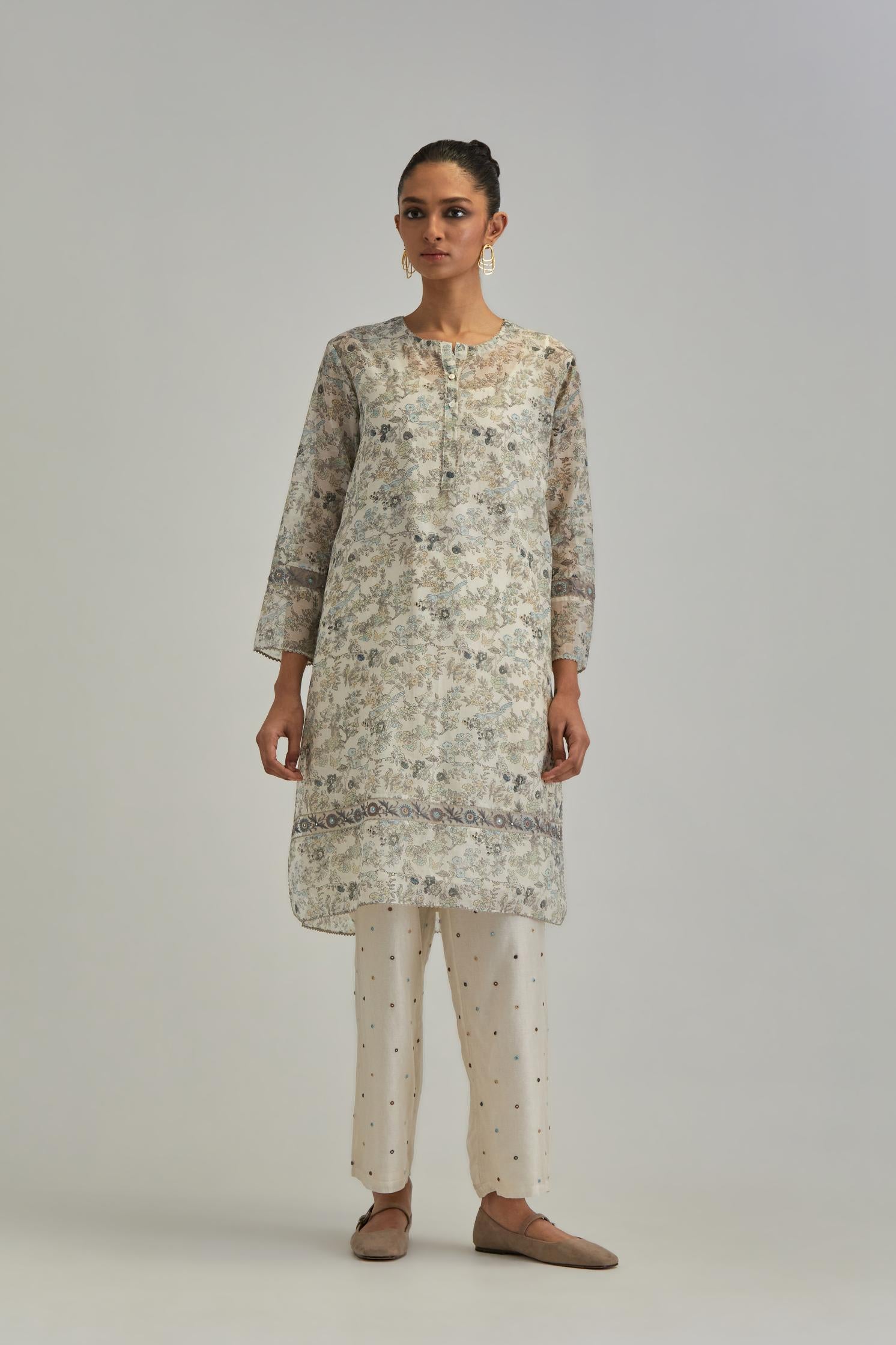 Silk Chanderi short kurta set with all-over earthy coloured hand block print and embroidery at kurta hem and sleeves.