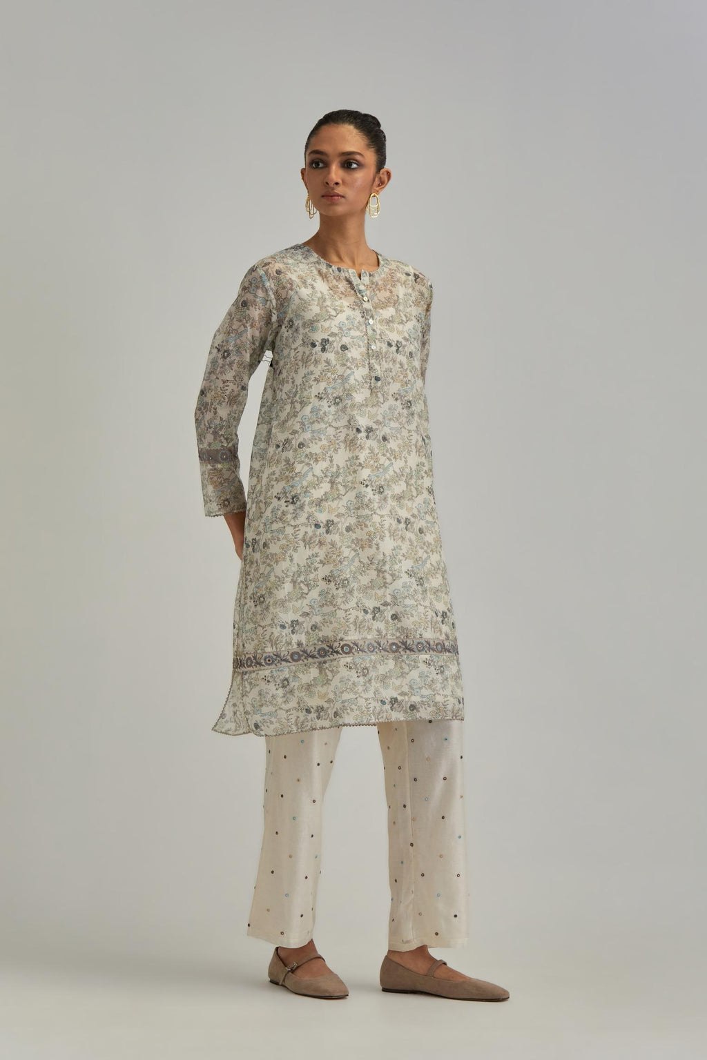 Silk Chanderi short kurta set with all-over earthy coloured hand block print and embroidery at kurta hem and sleeves.