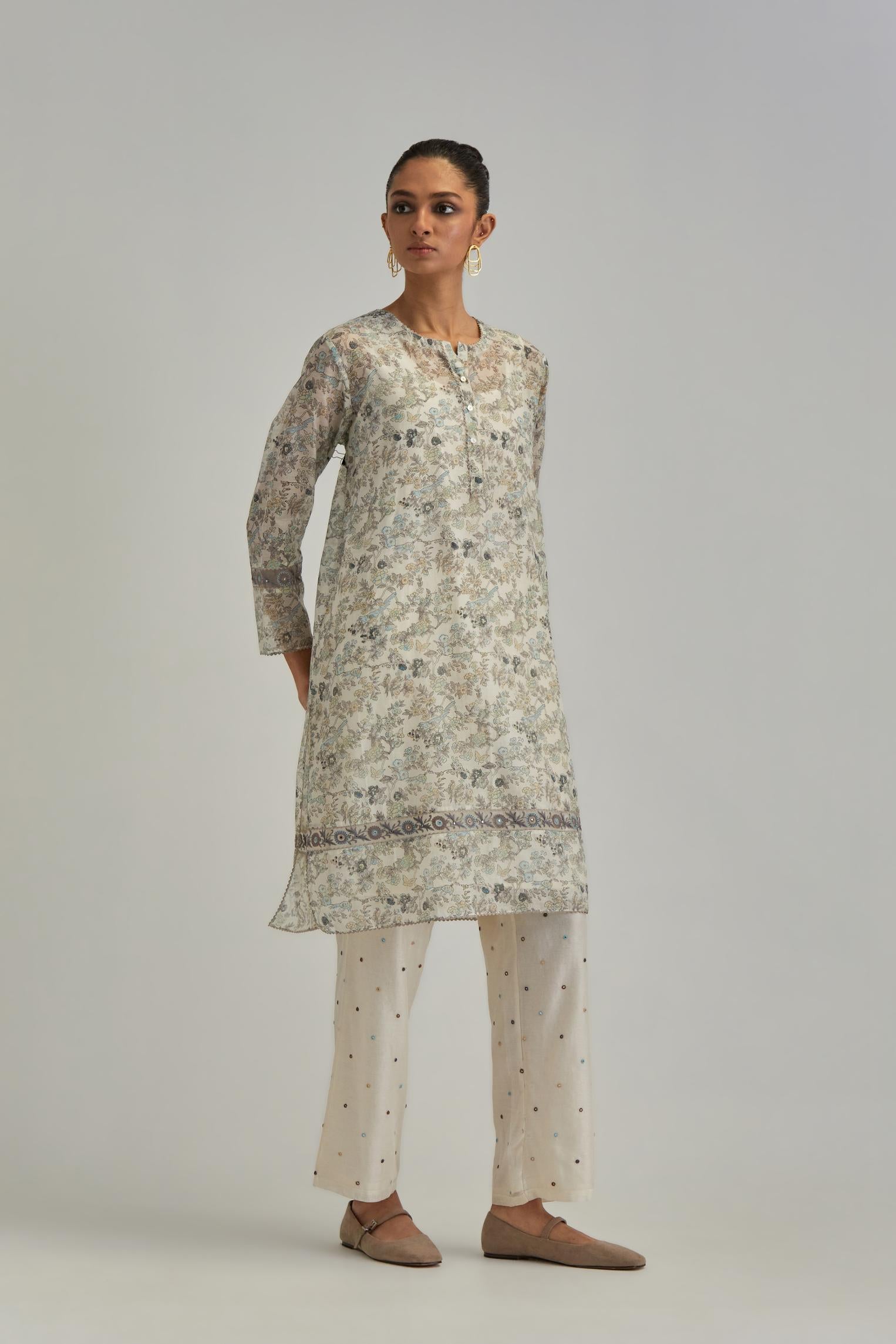 Silk Chanderi short kurta set with all-over earthy coloured hand block print and embroidery at kurta hem and sleeves.