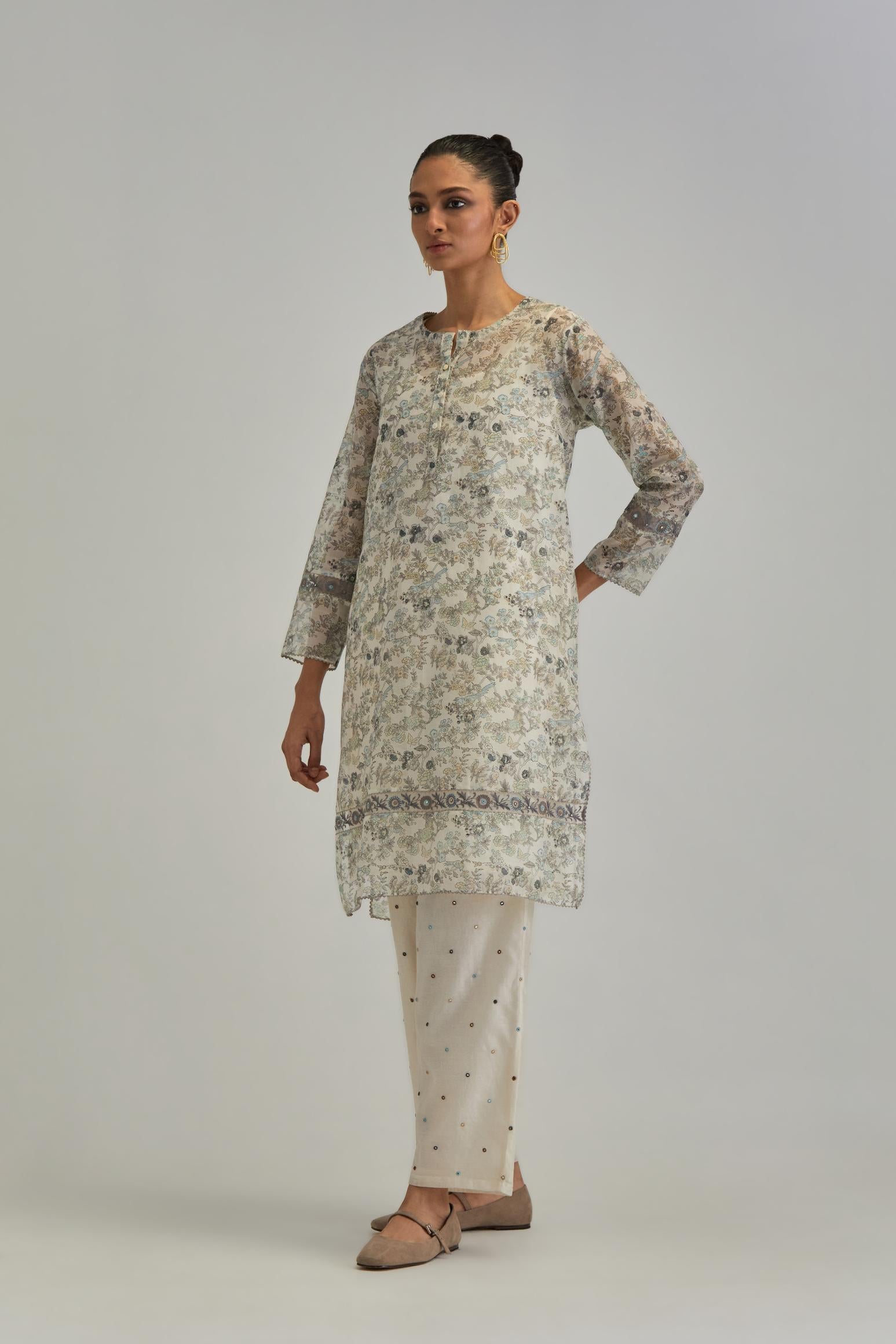 Silk Chanderi short kurta set with all-over earthy coloured hand block print and embroidery at kurta hem and sleeves.