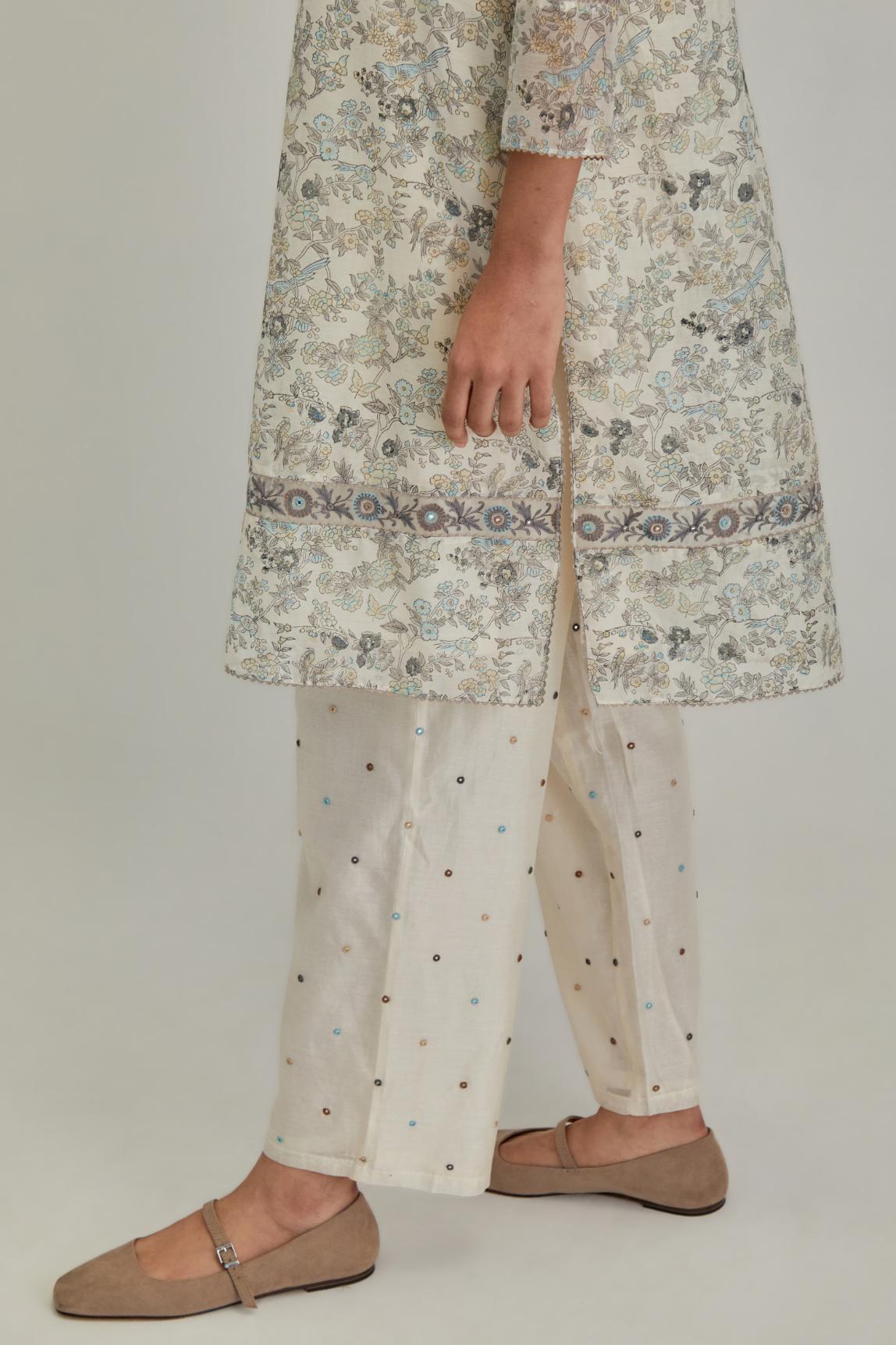 Silk Chanderi short kurta set with all-over earthy coloured hand block print and embroidery at kurta hem and sleeves.