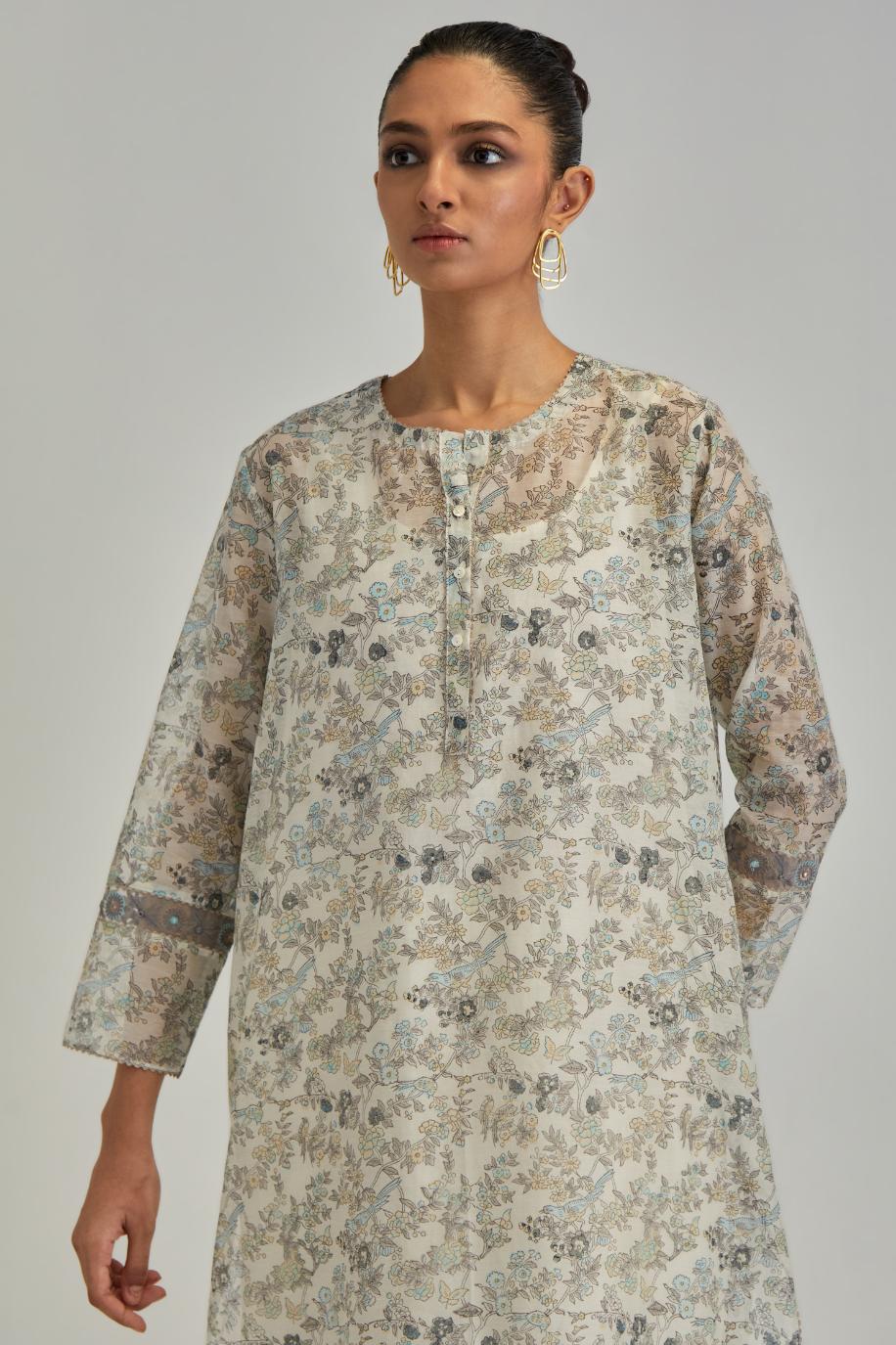 Silk Chanderi short kurta set with all-over earthy coloured hand block print and embroidery at kurta hem and sleeves.