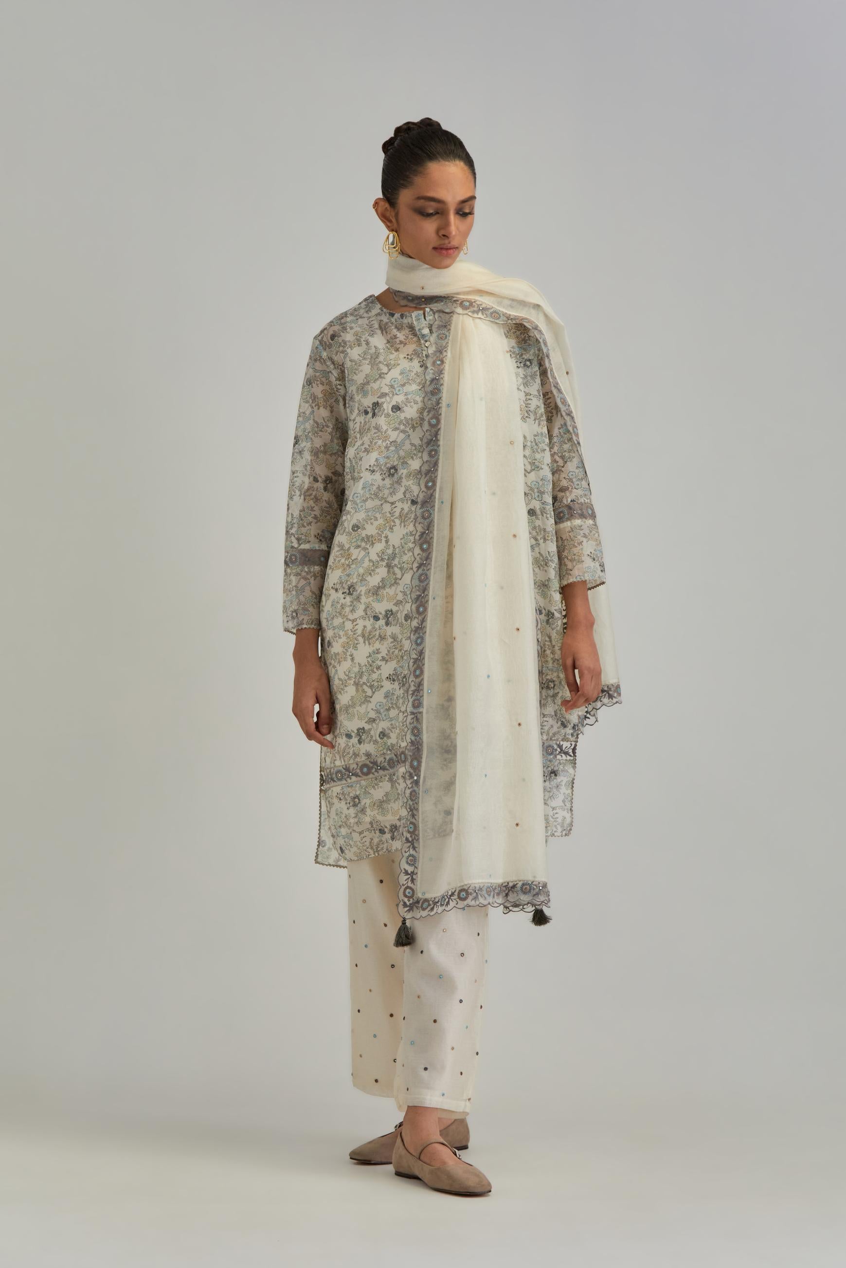 Silk Chanderi short kurta set with all-over earthy coloured hand block print and embroidery at kurta hem and sleeves.