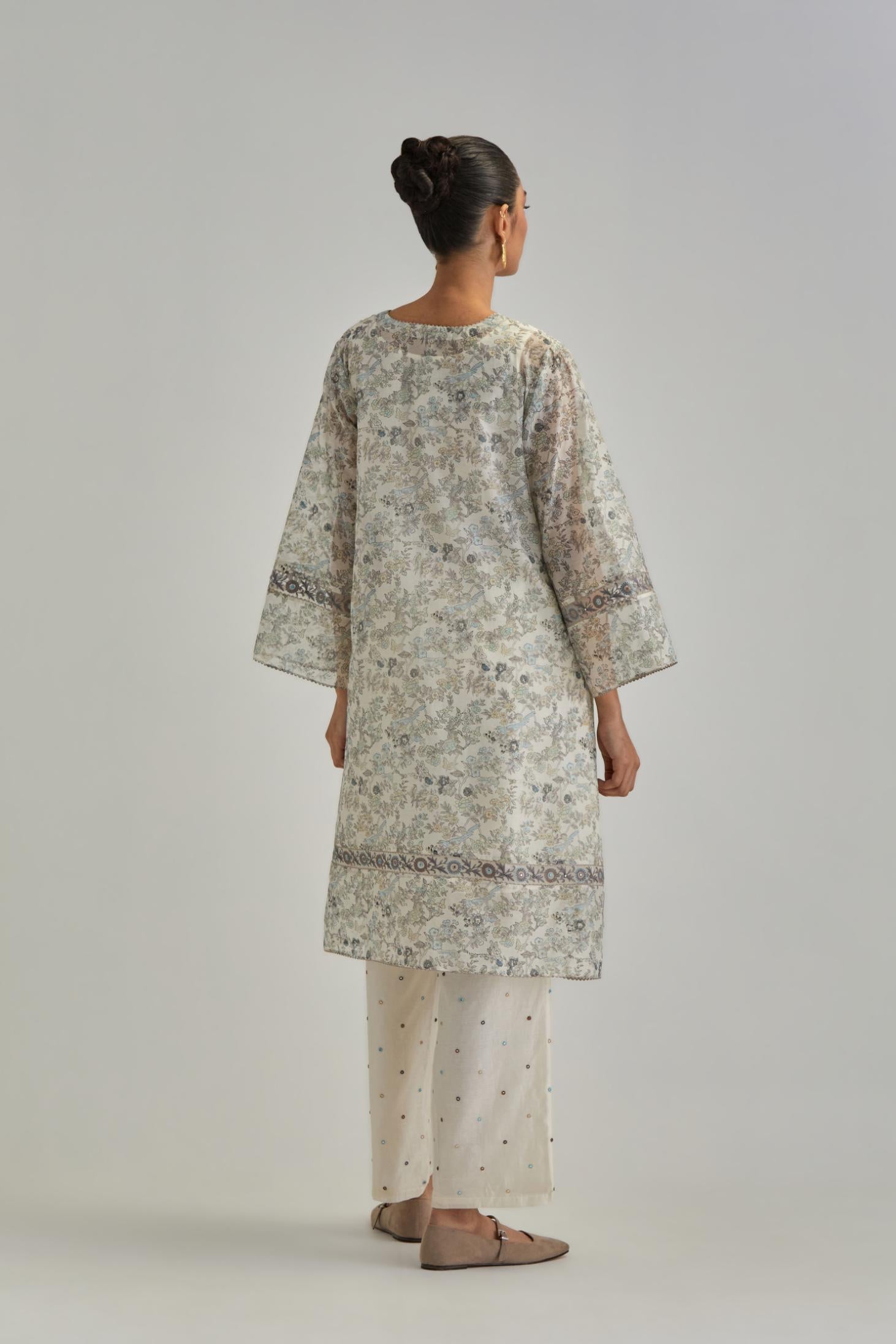 Silk Chanderi short A-line kurta set with all-over earthy coloured hand block print and embroidery at kurta hem and sleeves.