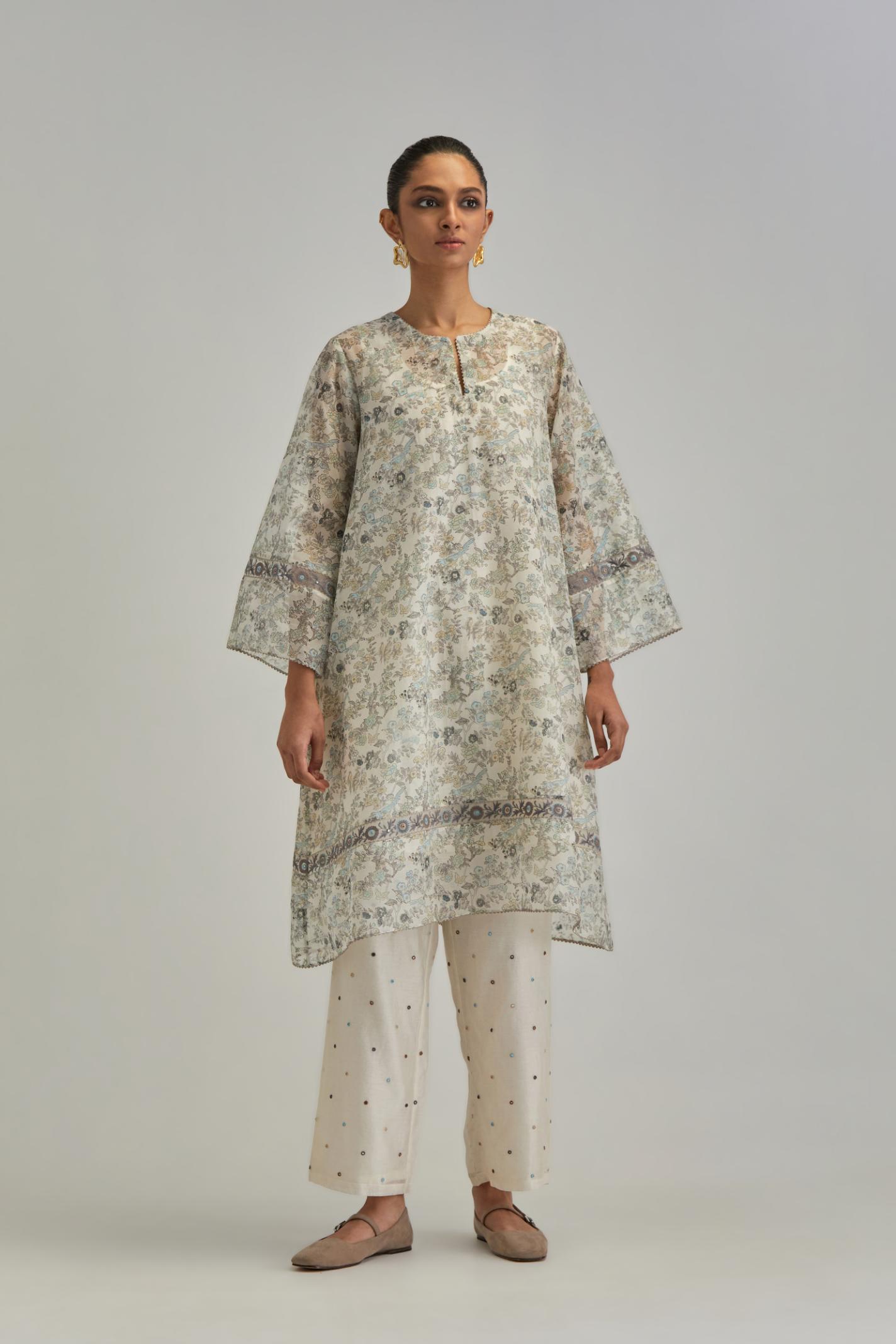 Silk Chanderi short A-line kurta set with all-over earthy coloured hand block print and embroidery at kurta hem and sleeves.