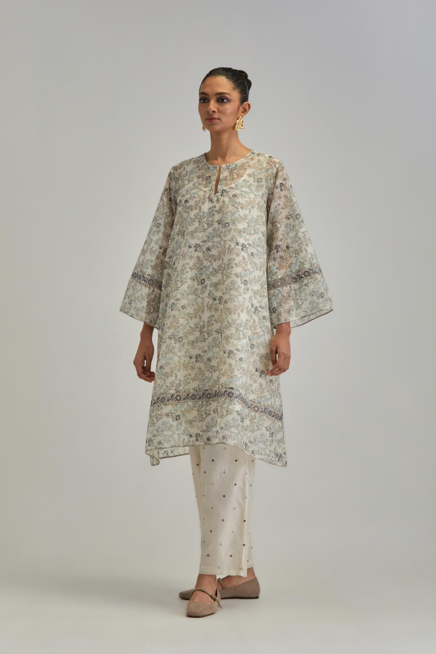 Silk Chanderi short A-line kurta set with all-over earthy coloured hand block print and embroidery at kurta hem and sleeves.