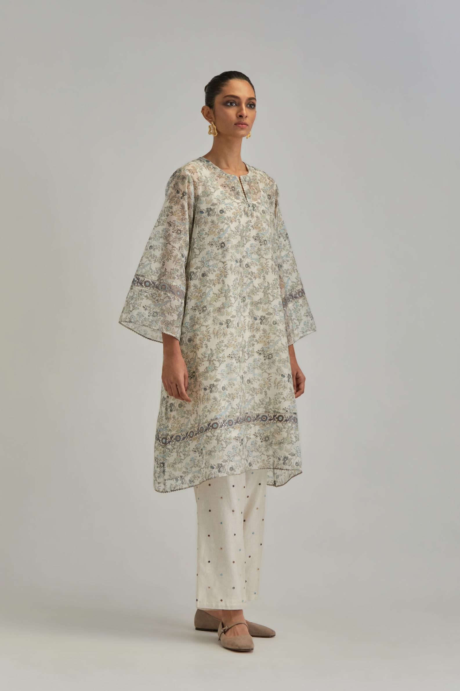 Silk Chanderi short A-line kurta set with all-over earthy coloured hand block print and embroidery at kurta hem and sleeves.